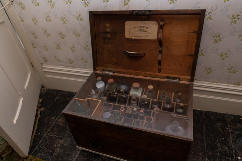 Old medicine cabinet with its lid open.